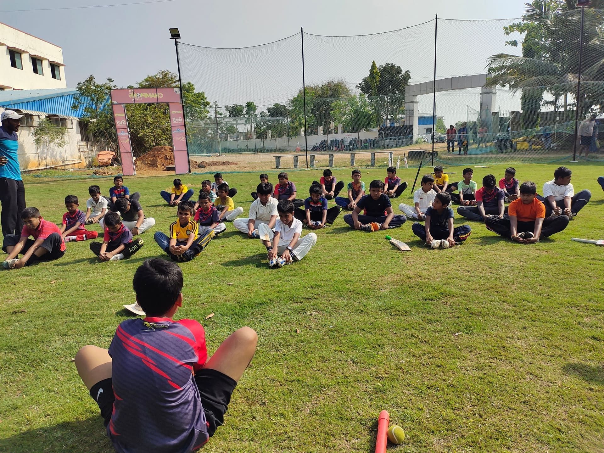 Unleashing Champions youth academy squad stretching at practice grounds